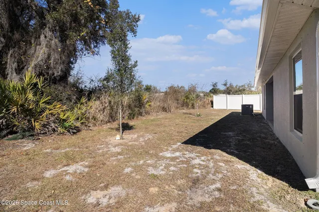 a view of balcony with wooden floor and city view