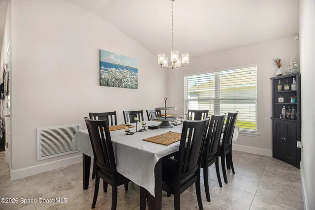 a view of a dining room with furniture window and outside view