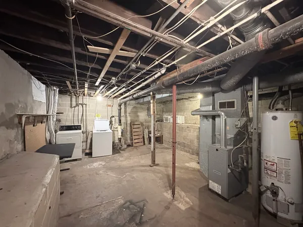 a view of empty room with wooden ceiling