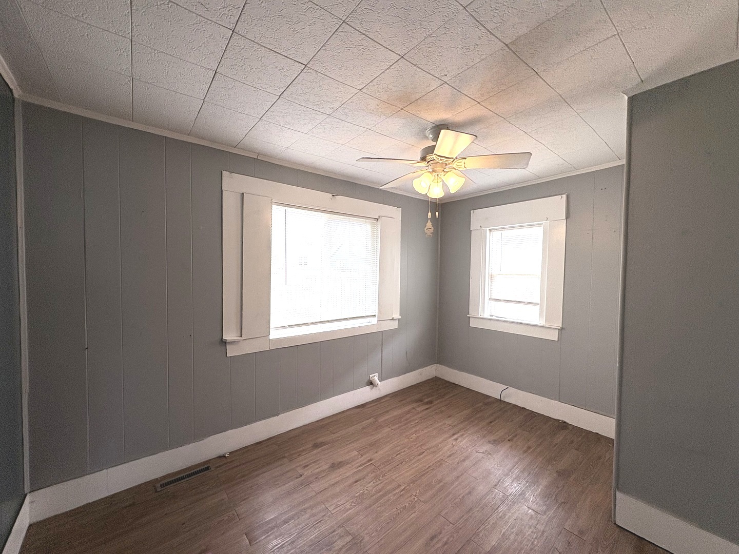 710 Mulberry Street Ottawa, IL 61350 - Photo 7 of 15 a view of an empty room with a window and wooden floor