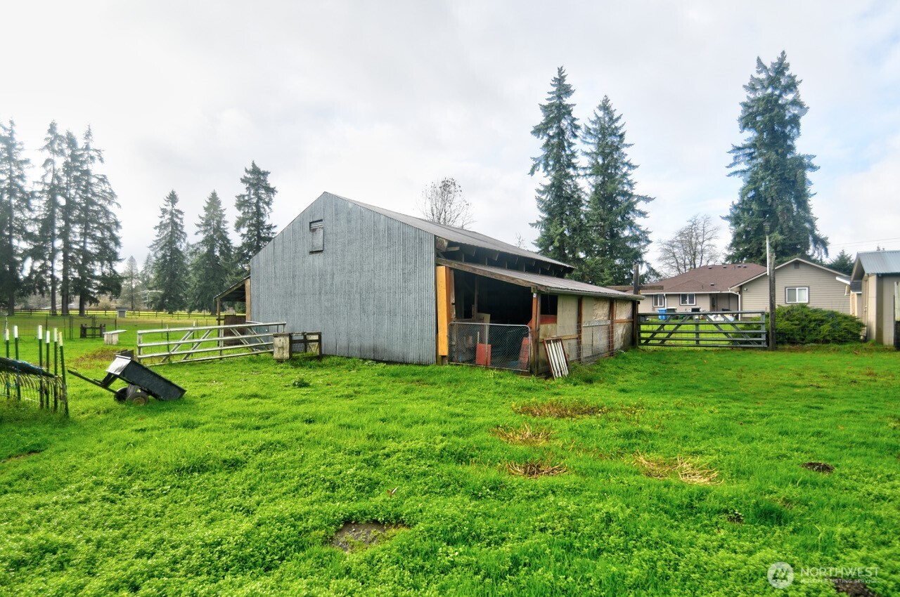 19944 Carper Road Southwest Rochester, WA 98579 - Photo 22 of 27 a backyard of a house with table and chairs