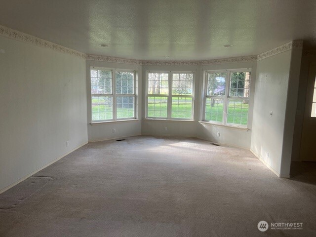19944 Carper Road Southwest Rochester, WA 98579 - Photo 6 of 27 a view of an empty room with a window