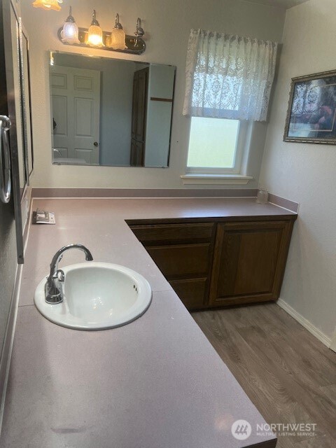 19944 Carper Road Southwest Rochester, WA 98579 - Photo 8 of 27 a bathroom with a sink and mirror