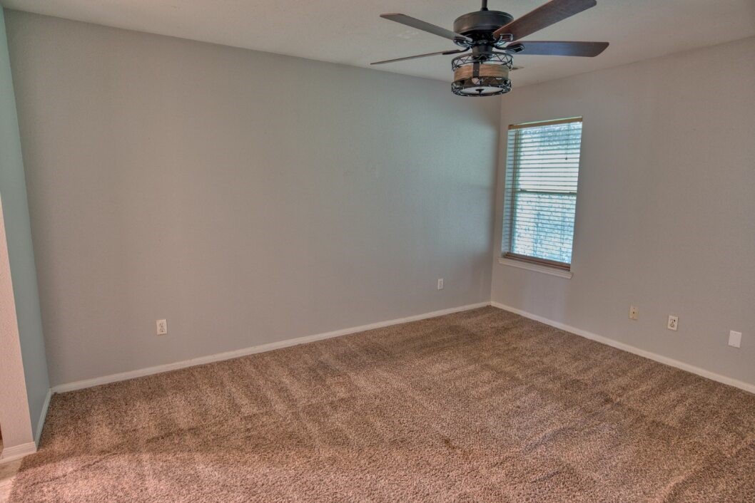 308 County Road 893B Angleton, TX 77515 - Photo 30 of 41 an empty room with windows and fan