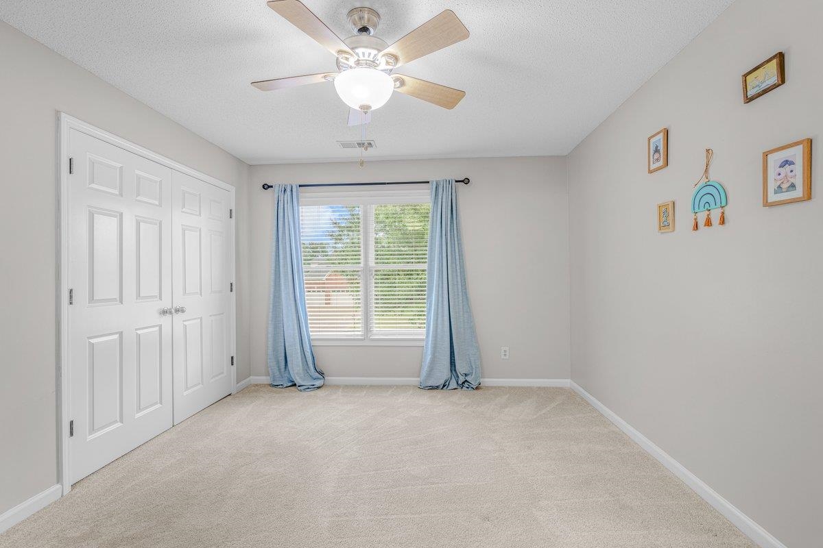 4840 Rainy Pass Road Collierville, TN 38017 - Photo 18 of 30 Neutral-toned room featuring a window with blinds, ceiling fan with light fixture, light gray walls, and light-colored carpet