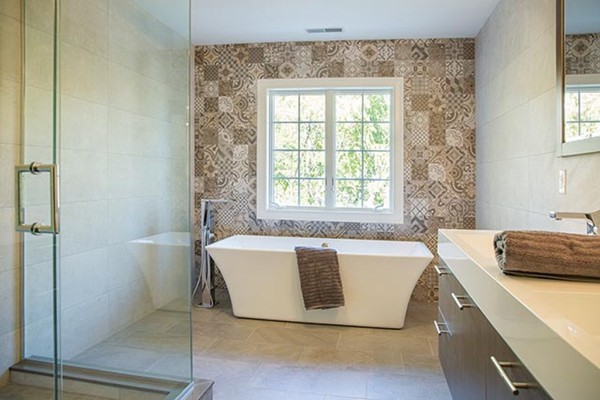 85 Pond Brook Road Newton, MA 02467 - Photo 6 of 6 a bath tub sitting in a bathroom next to a window