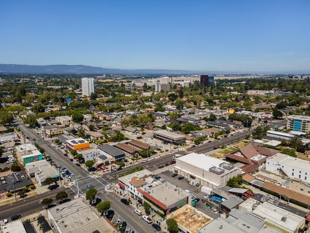 a view of a patio with table and chairs