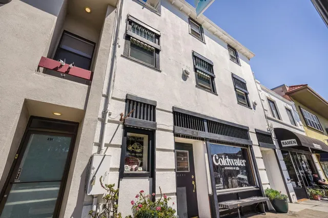 a view of a building with sitting area