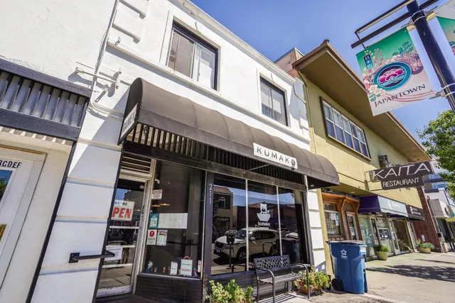 a group of cars parked in front of building