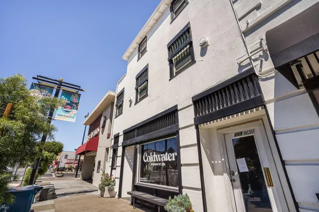 a view of a swimming pool with outdoor seating