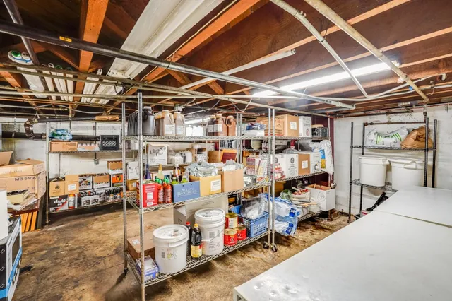 a bathroom with a sink a vanity and a window