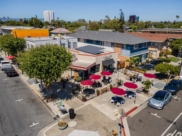 an aerial view of a city with ocean view