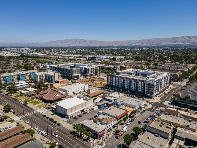 a view of a building with sitting area