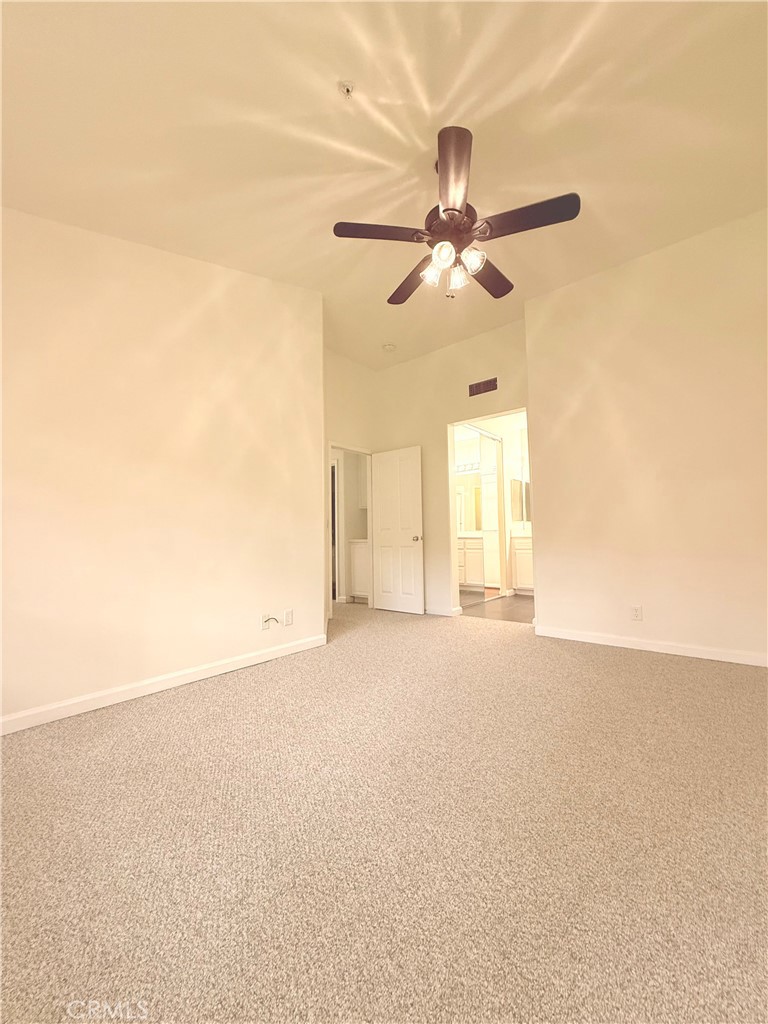 2771 Dunstan Drive Tustin, CA 92782 - Photo 26 of 39 an empty room with windows and fan