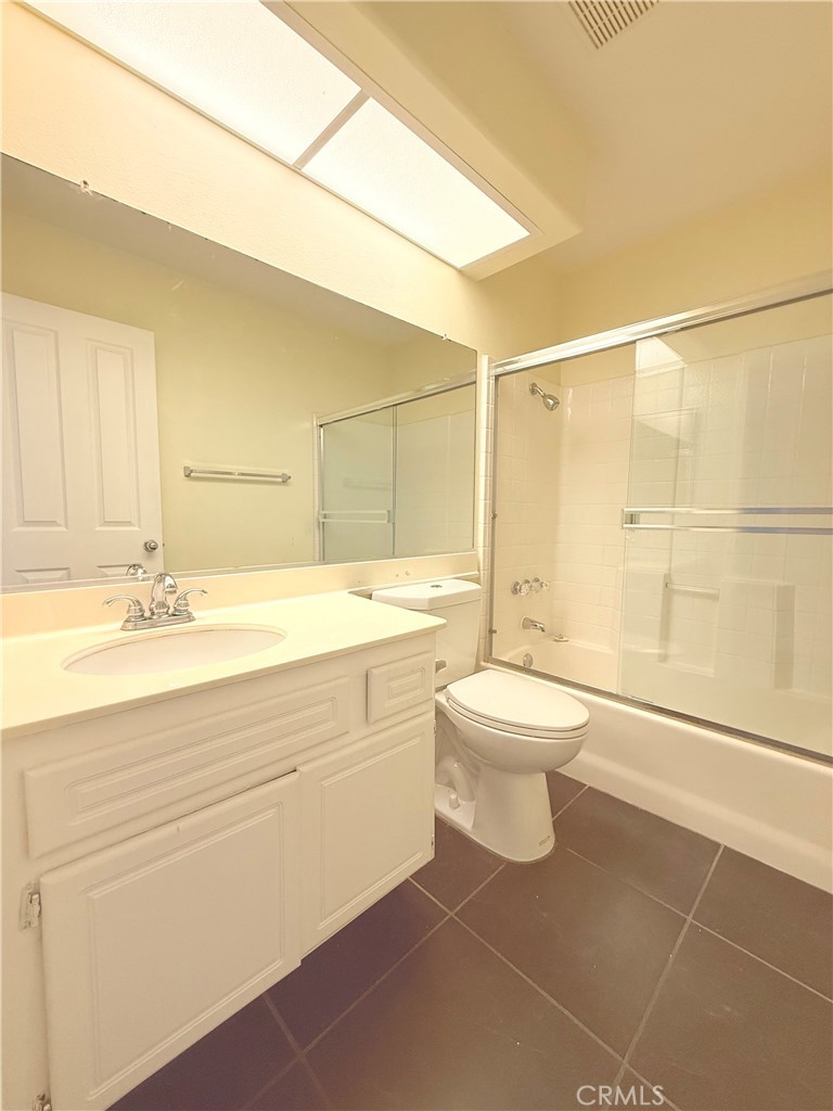 2771 Dunstan Drive Tustin, CA 92782 - Photo 33 of 39 a bathroom with a sink a toilet and shower
