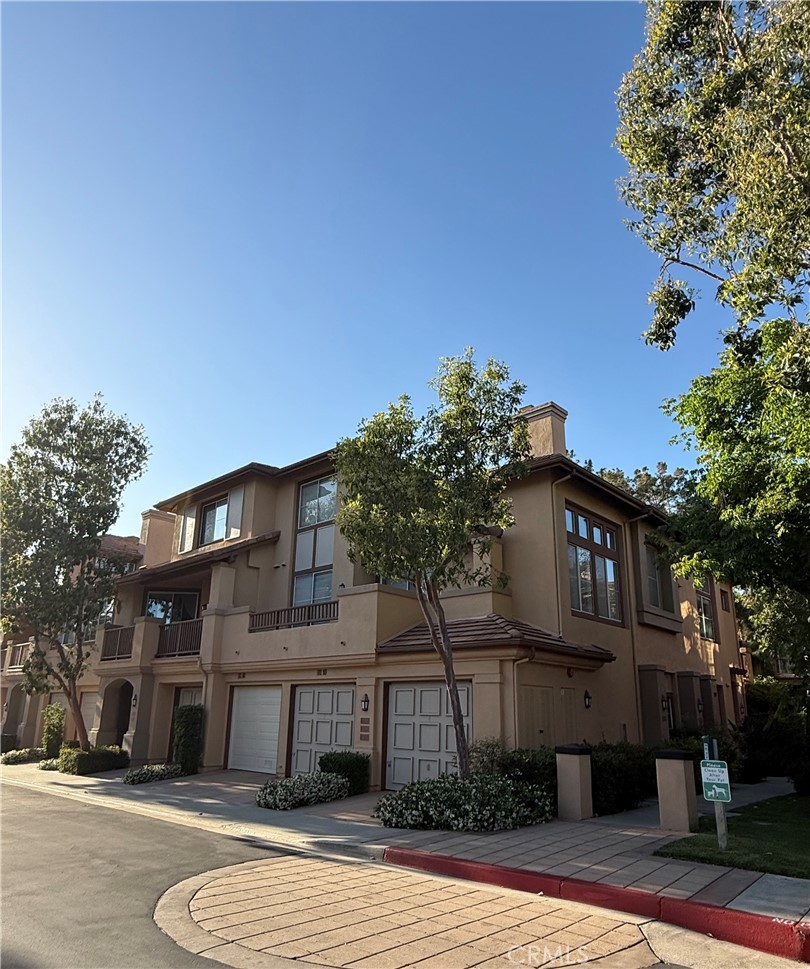 2771 Dunstan Drive Tustin, CA 92782 - Photo 5 of 39 a view of a building with a yard