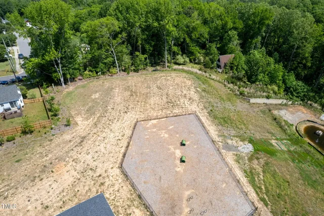 an aerial view of a houses with outdoor space and city view