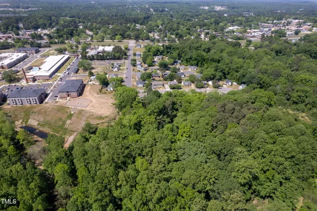 an aerial view of residential house with outdoor space