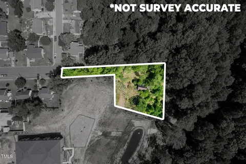 an aerial view of residential house with outdoor space and street view