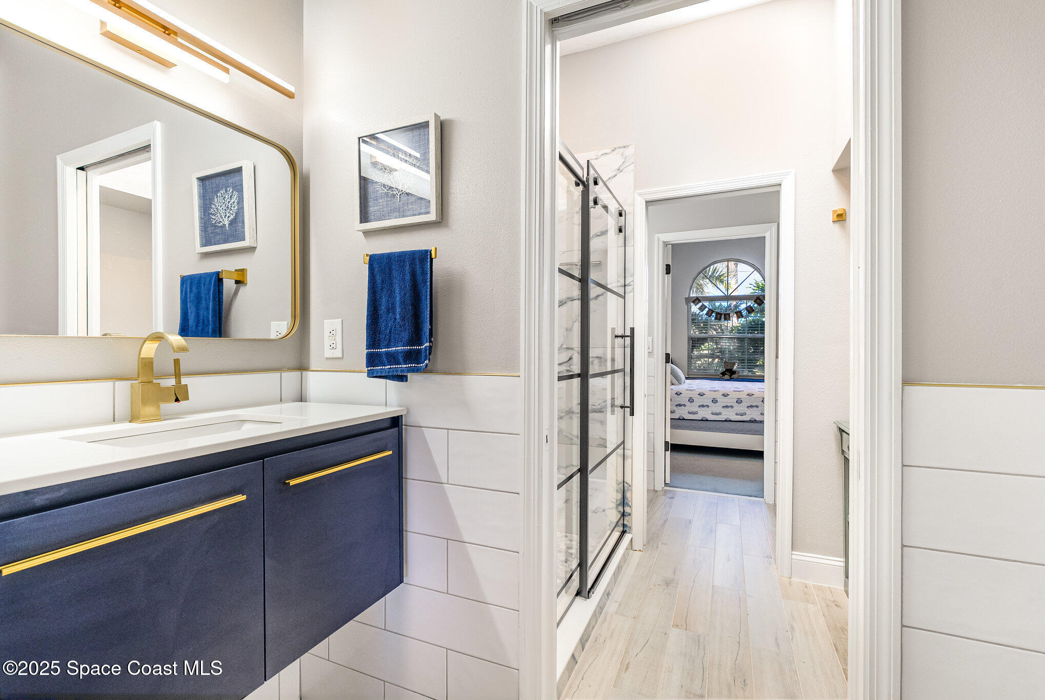 1617 Sun Point Place Merritt Island, FL 32952 - Photo 13 of 42 a spacious bathroom with a sink and a mirror