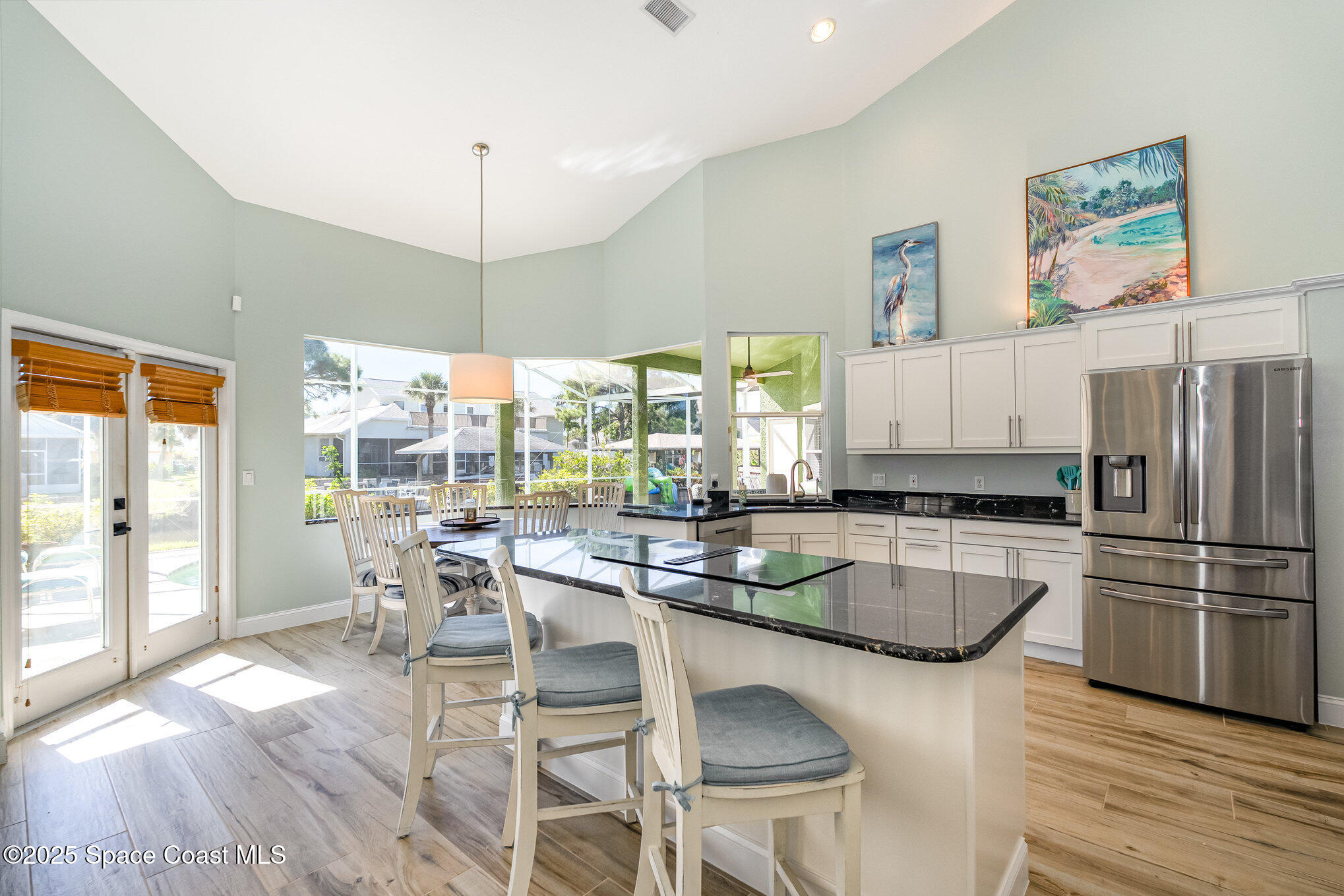 1617 Sun Point Place Merritt Island, FL 32952 - Photo 15 of 42 a table and chairs in a kitchen