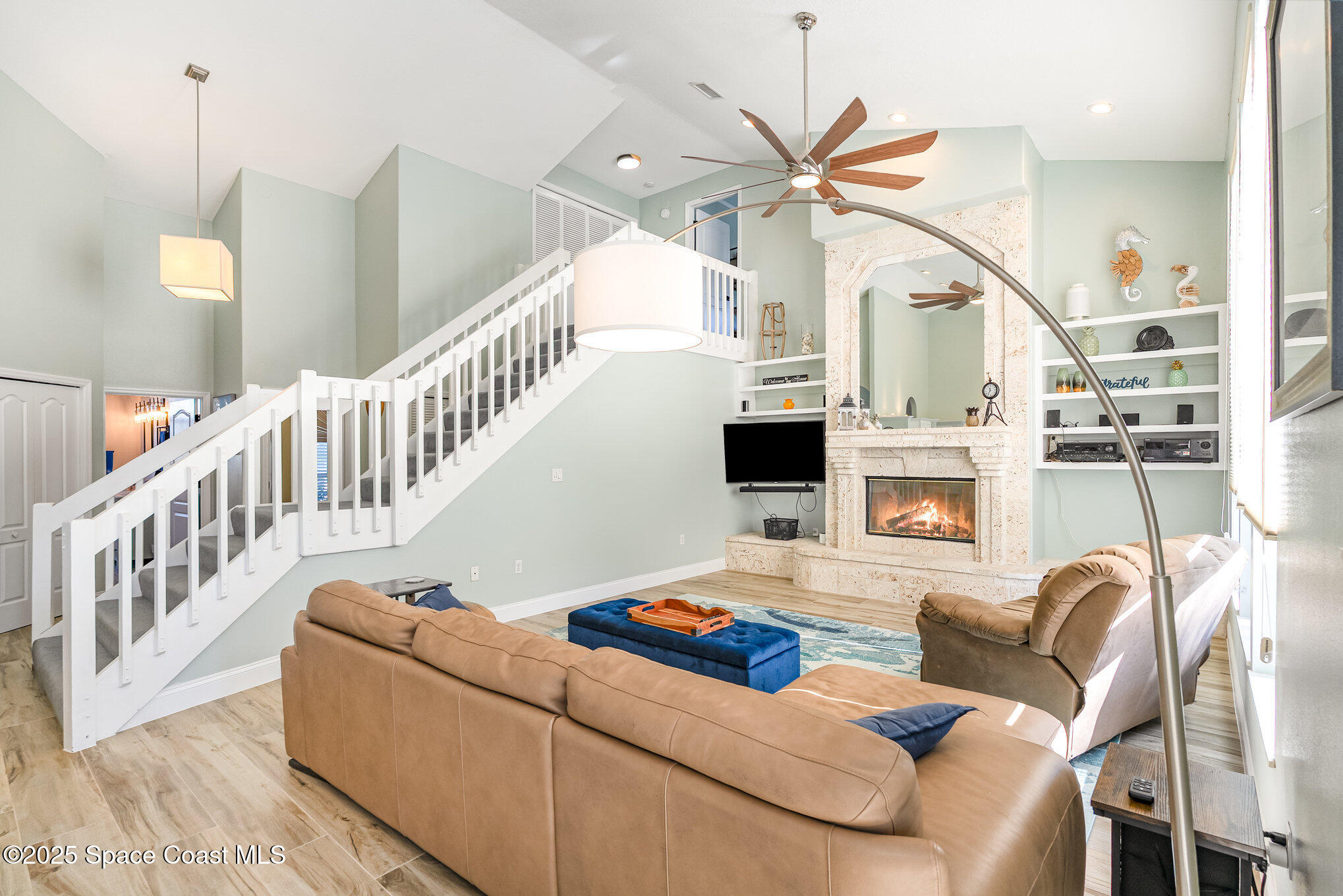 1617 Sun Point Place Merritt Island, FL 32952 - Photo 17 of 42 a living room with furniture and a chandelier