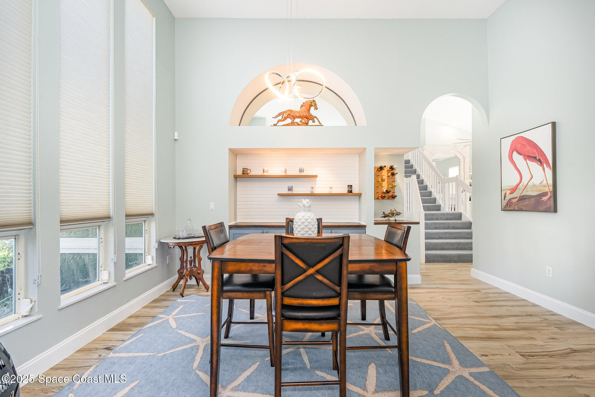 1617 Sun Point Place Merritt Island, FL 32952 - Photo 18 of 42 a view of a dining room with furniture window and wooden floor