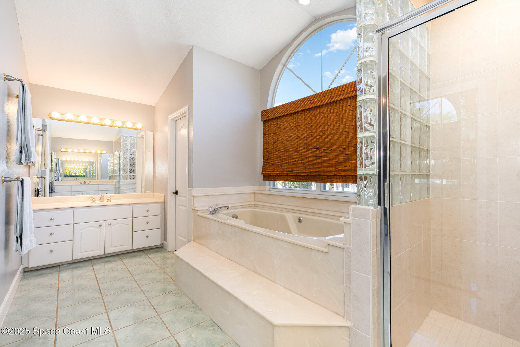 1617 Sun Point Place Merritt Island, FL 32952 - Photo 20 of 42 a large bathroom with a tub sink shower and mirror