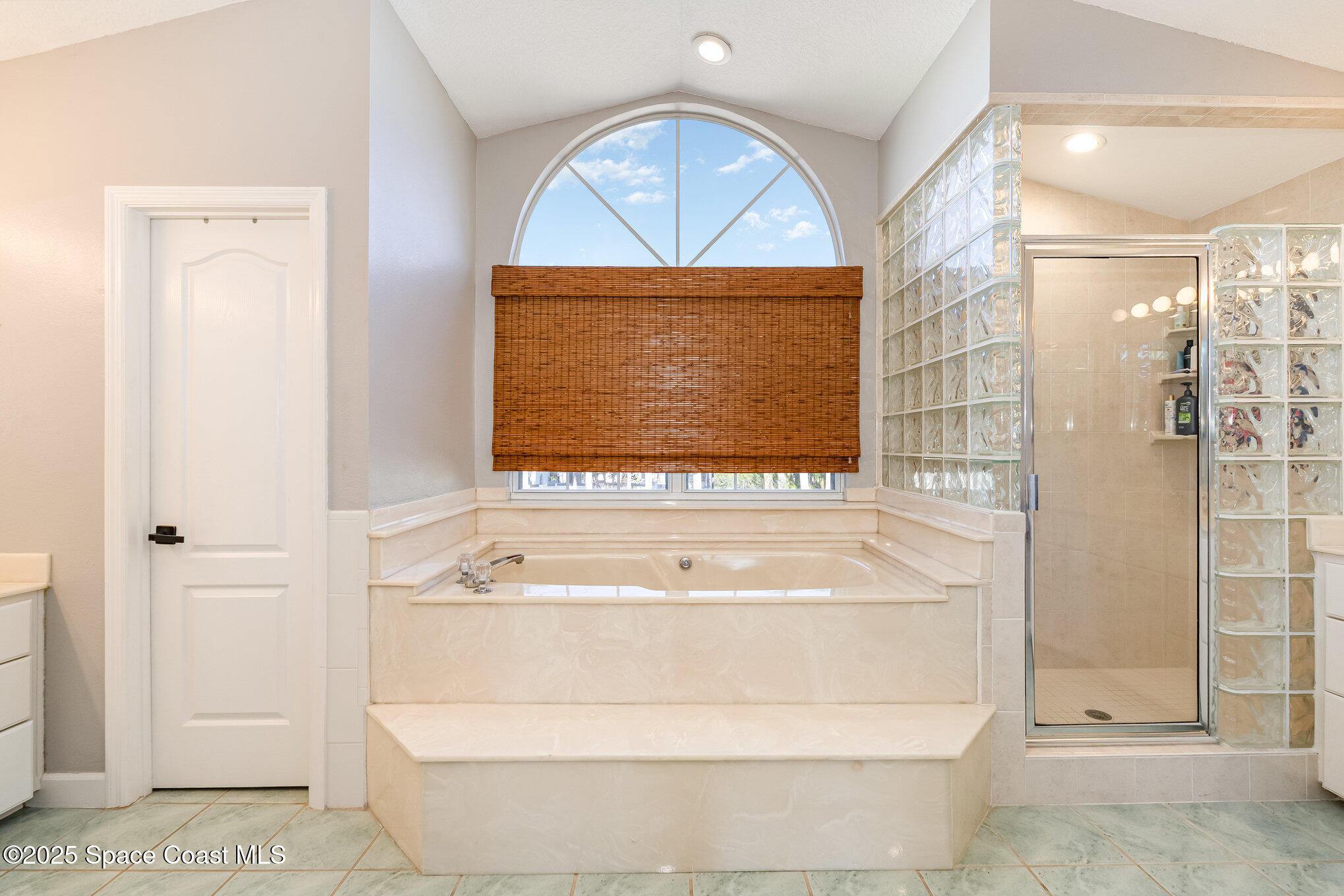 1617 Sun Point Place Merritt Island, FL 32952 - Photo 22 of 42 a bathroom with a tub a shower and a sink