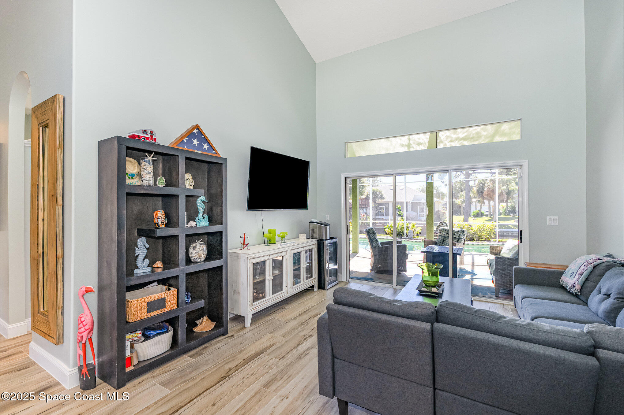 1617 Sun Point Place Merritt Island, FL 32952 - Photo 23 of 42 a living room with furniture and a flat screen tv