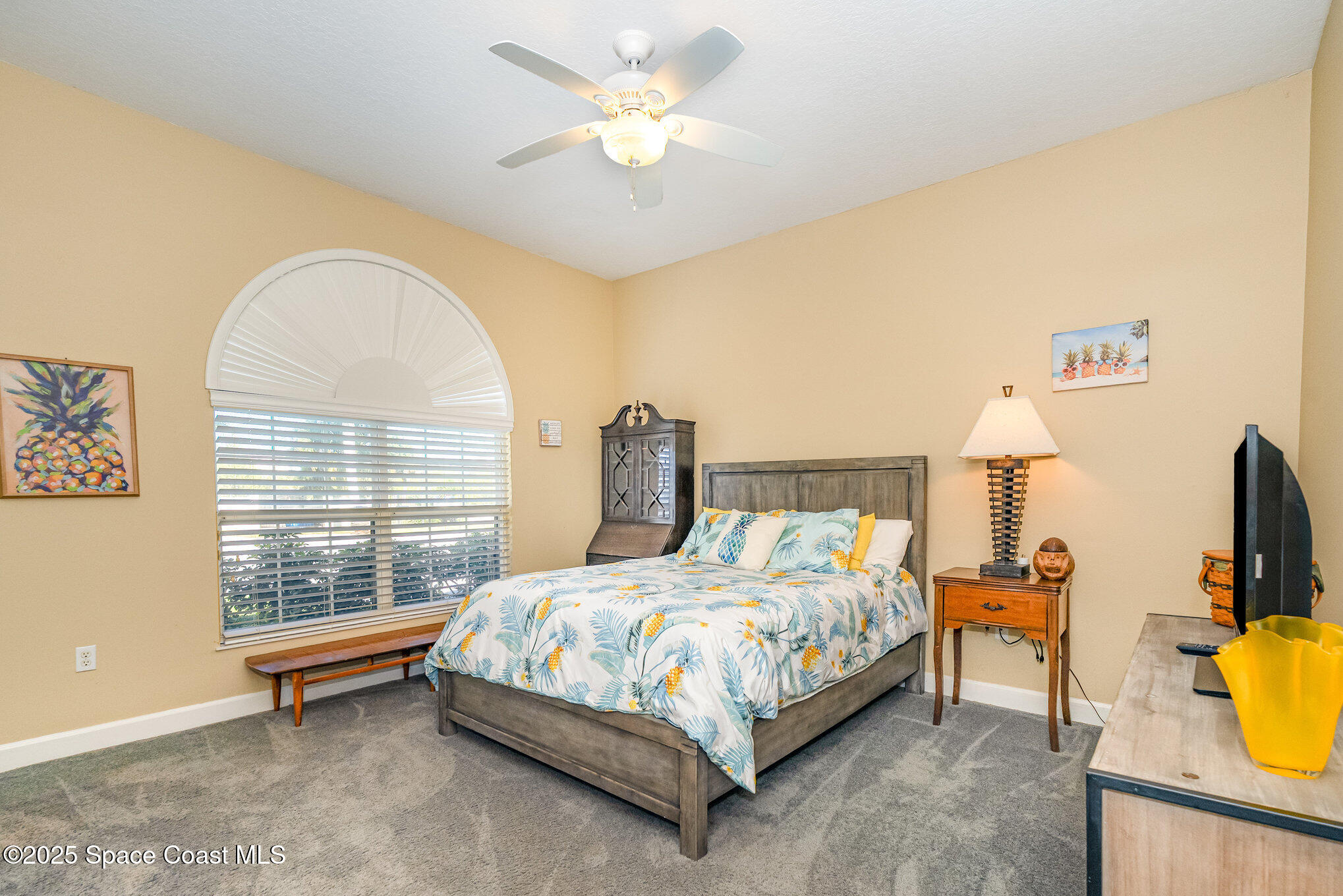 1617 Sun Point Place Merritt Island, FL 32952 - Photo 27 of 42 a bedroom with a bed and a window