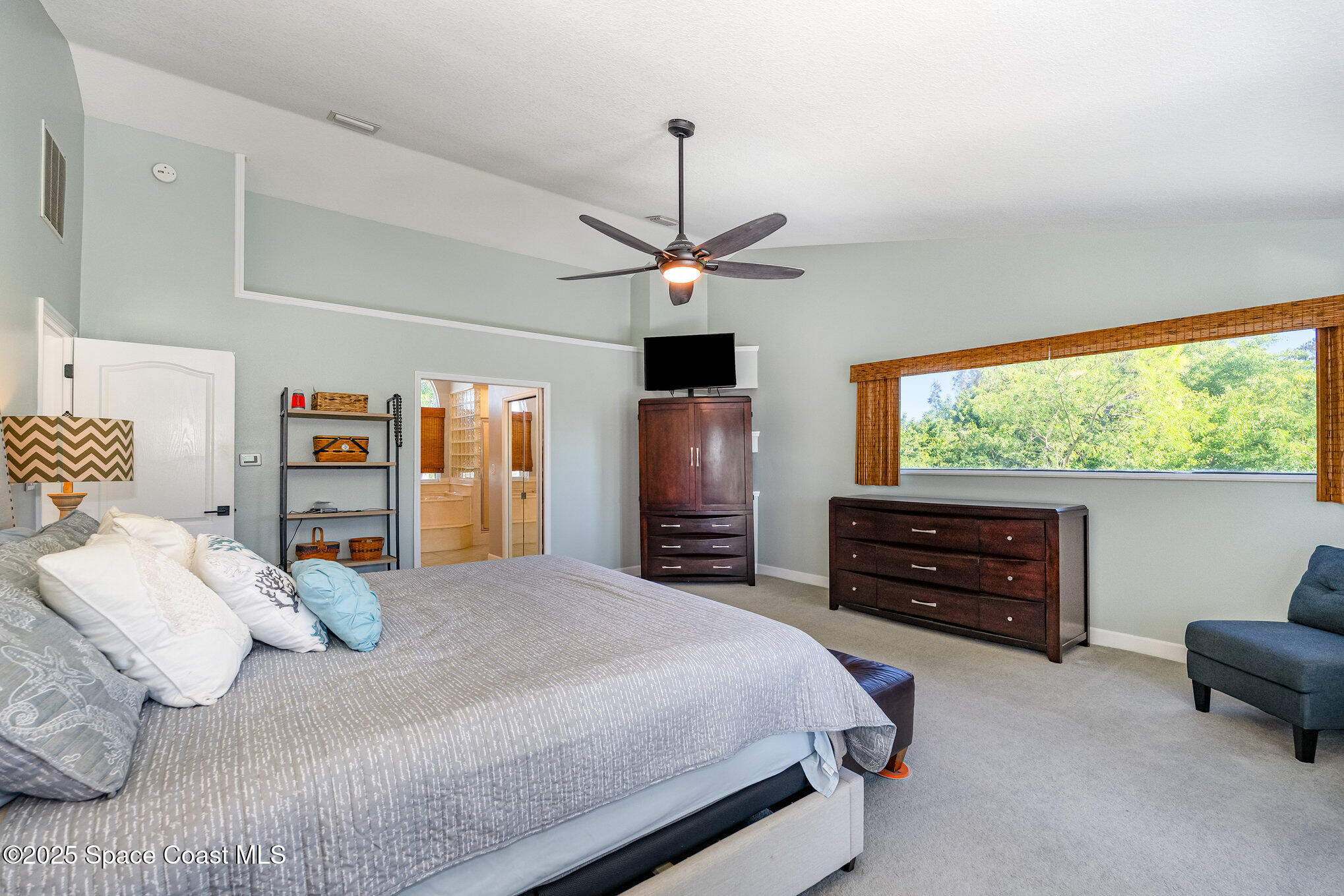 1617 Sun Point Place Merritt Island, FL 32952 - Photo 30 of 42 a bedroom with a bed and a dresser