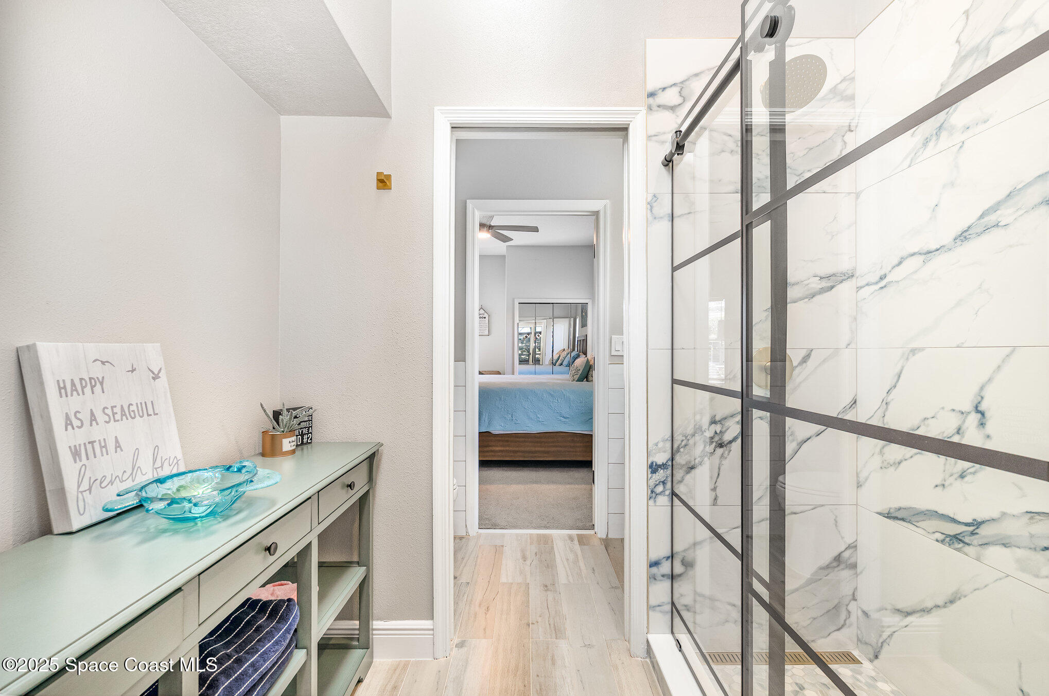1617 Sun Point Place Merritt Island, FL 32952 - Photo 31 of 42 a view of hallway with furniture and wooden floor