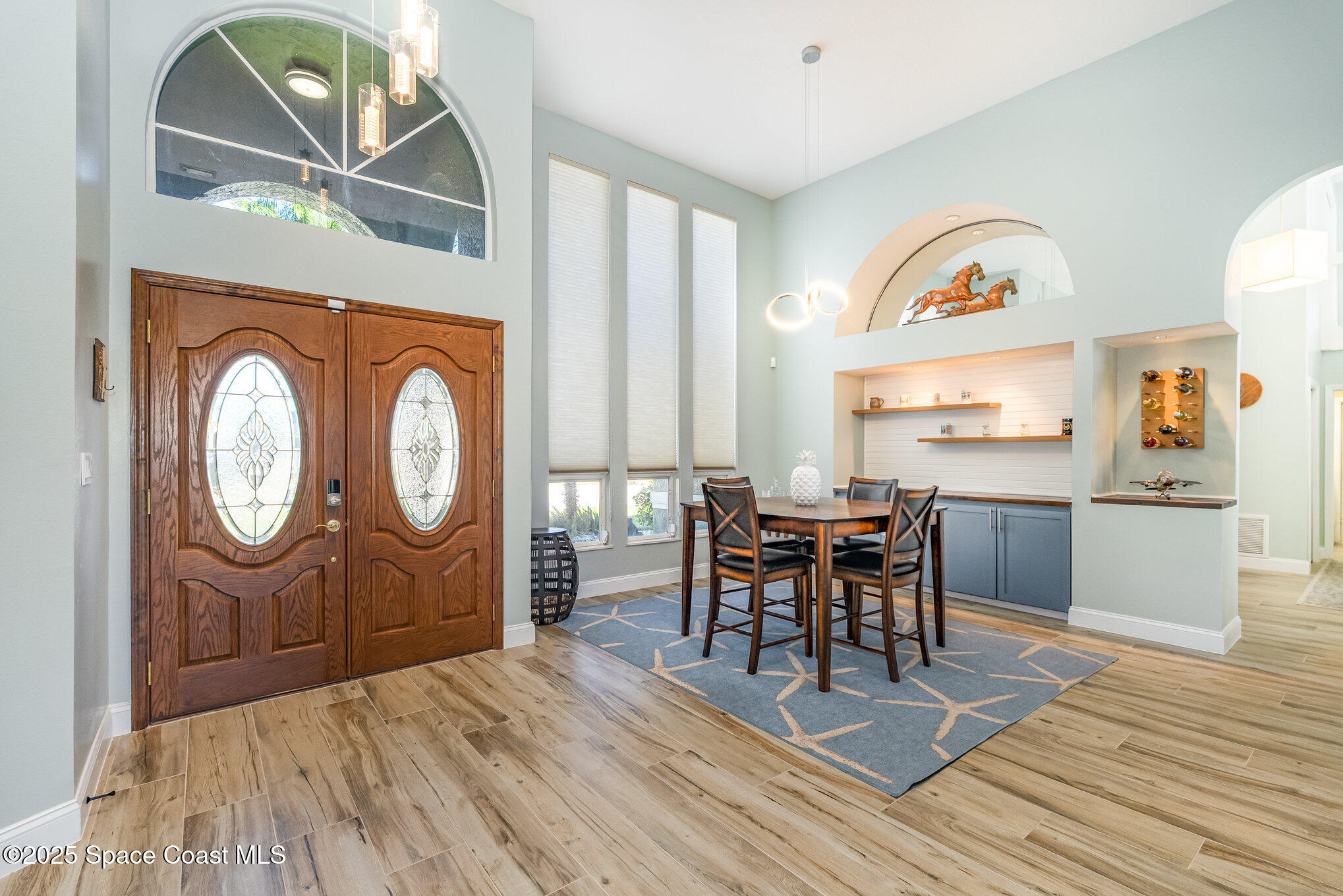 1617 Sun Point Place Merritt Island, FL 32952 - Photo 10 of 42 a view of a dining room with furniture window and wooden floor