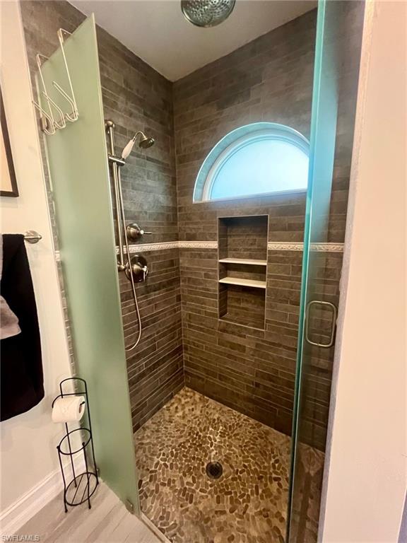 5003 Coach Lane Naples, FL 34114 - Photo 14 of 17 a bathroom with a shower