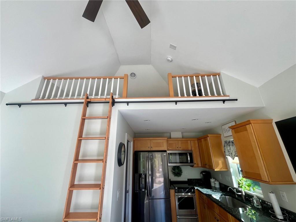 5003 Coach Lane Naples, FL 34114 - Photo 16 of 17 a view of staircase and kitchen view