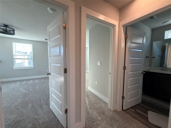a view of a hallway with closet