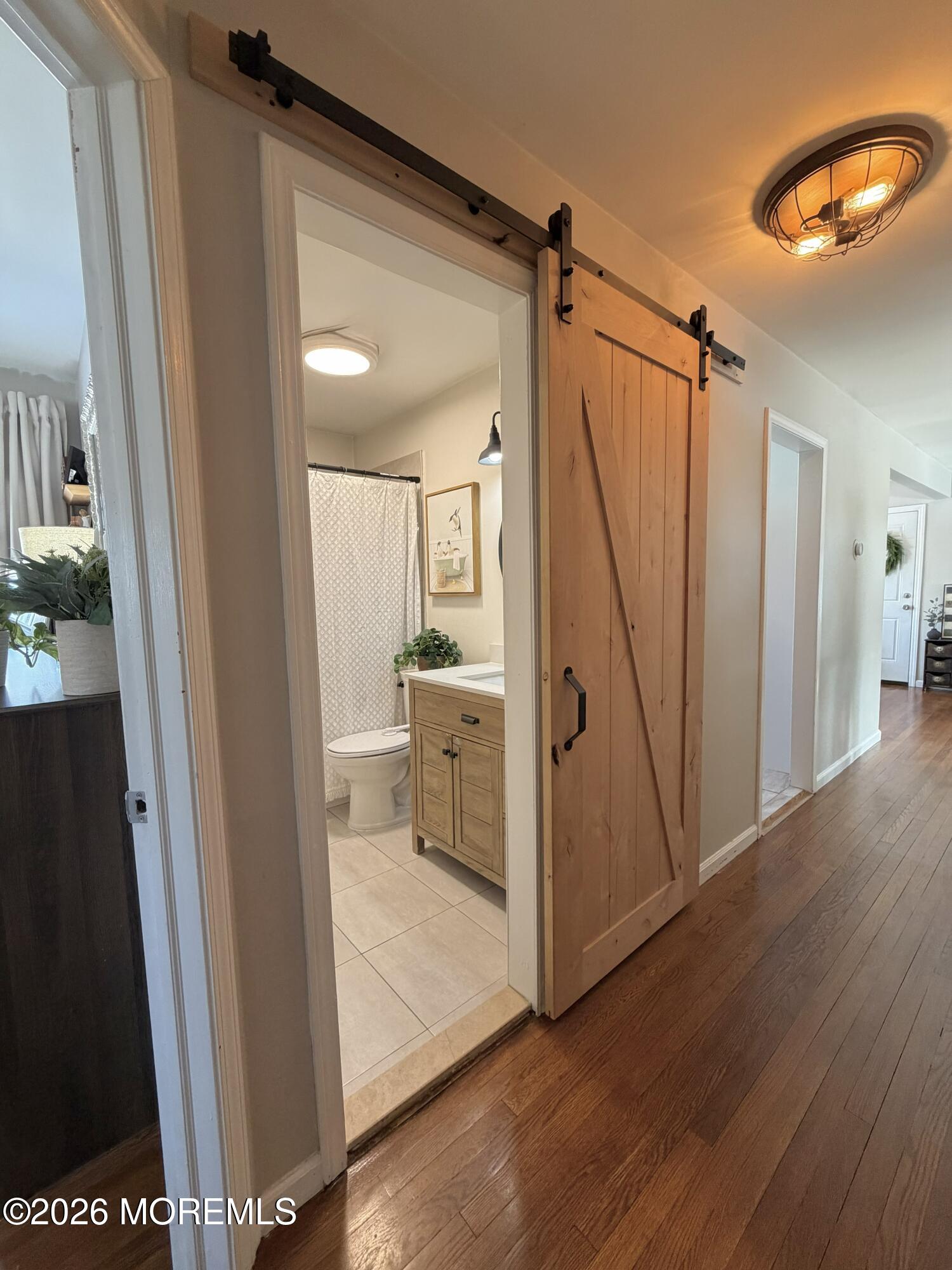 43 Lake Drive Howell, NJ 07731 - Photo 11 of 22 a view of a bathroom from a hallway