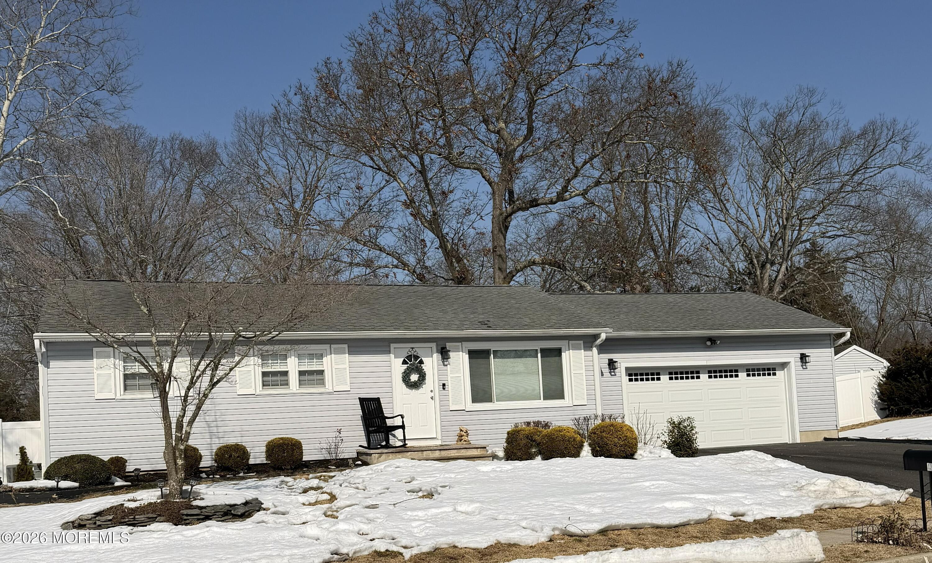 43 Lake Drive Howell, NJ 07731 - Photo 14 of 22 a view of a white house in the middle of a house