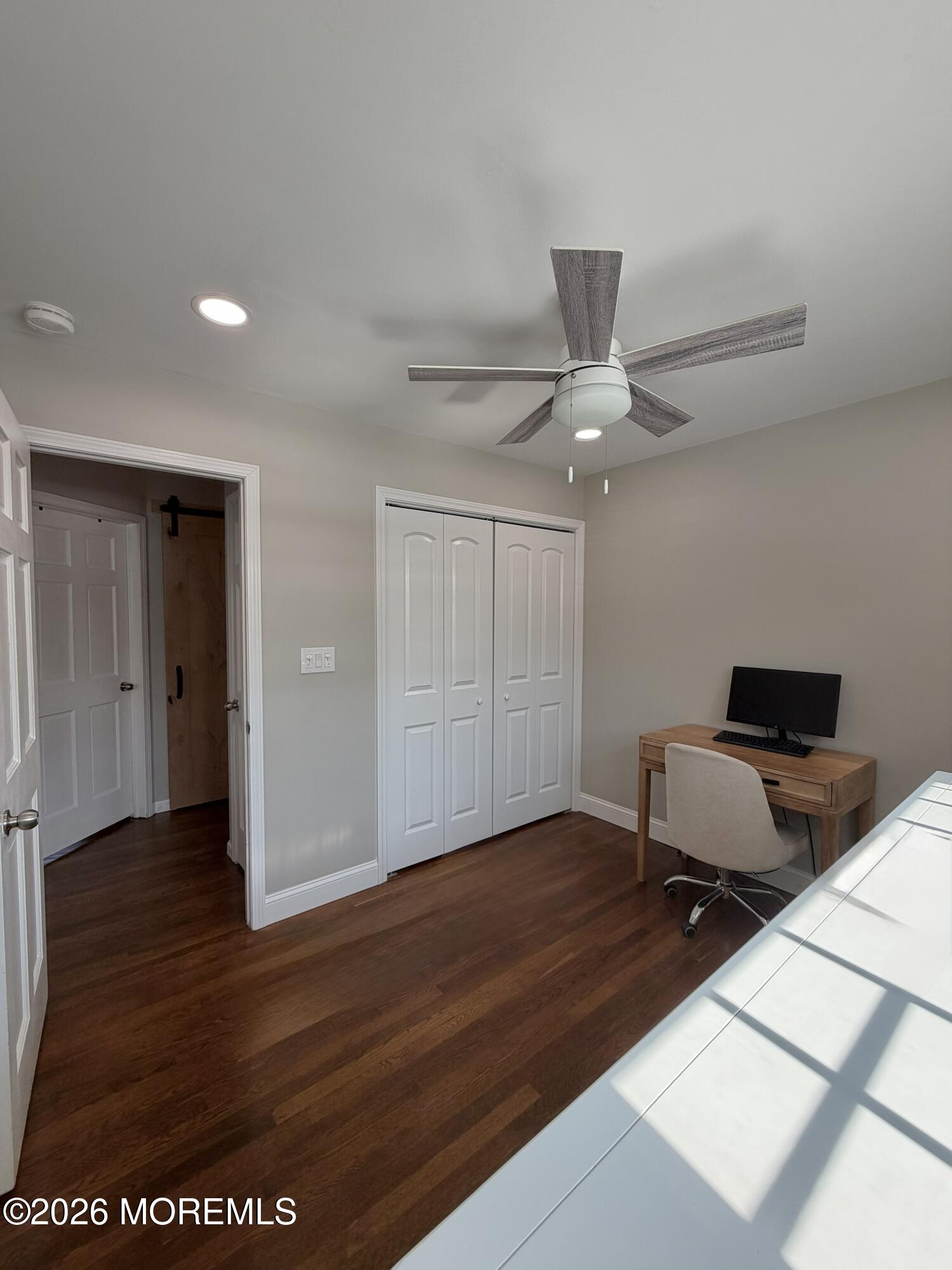 43 Lake Drive Howell, NJ 07731 - Photo 19 of 22 a workspace with wooden floor and white walls