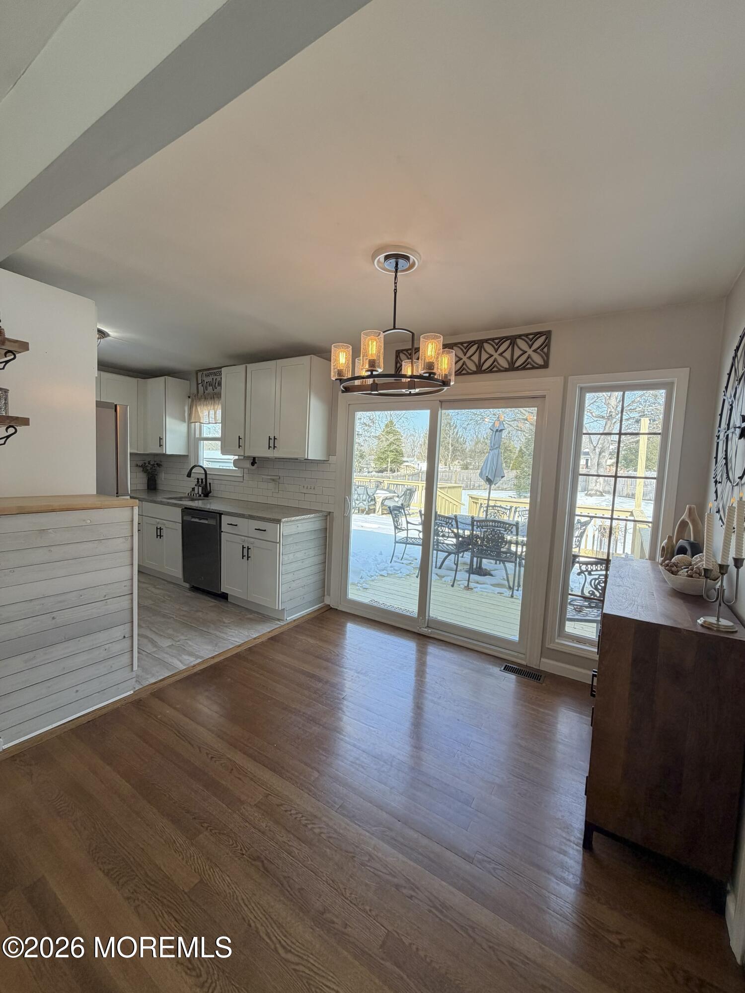 43 Lake Drive Howell, NJ 07731 - Photo 20 of 22 a view of a kitchen with wooden floor and stainless steel appliances