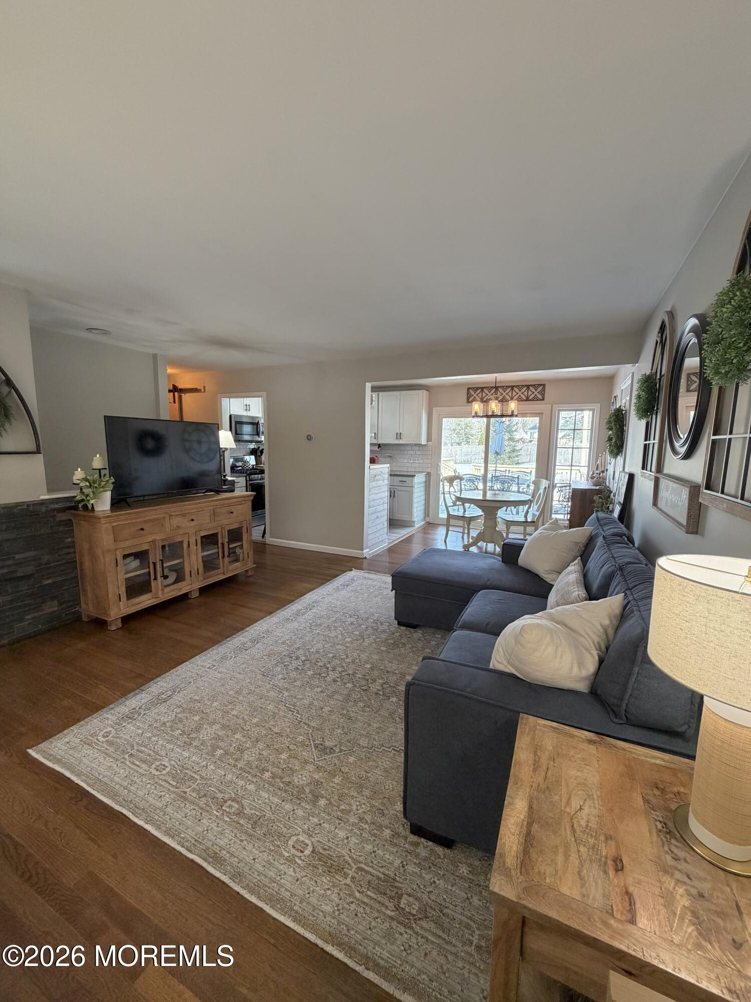 43 Lake Drive Howell, NJ 07731 - Photo 21 of 22 a living room with furniture and a flat screen tv