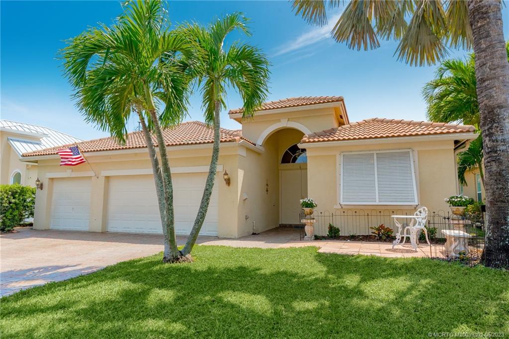 2032 Northwest Marsh Rabbit Lane Stuart, FL 34994 - Photo 12 of 30 a front view of a house with garden