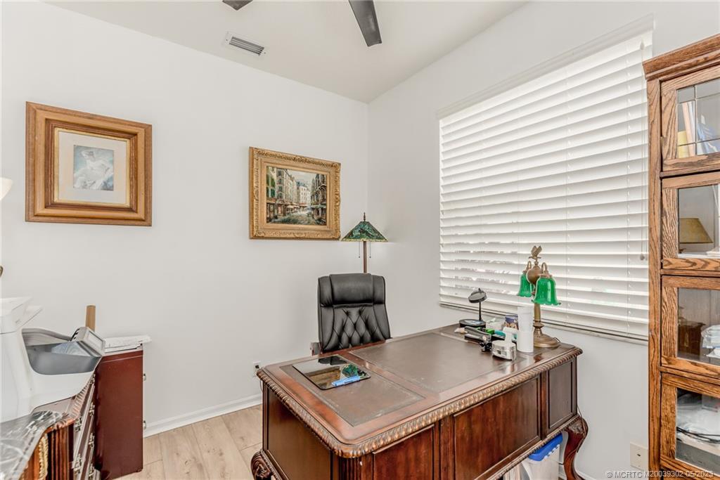 2032 Northwest Marsh Rabbit Lane Stuart, FL 34994 - Photo 23 of 30 a view of a workspace with furniture