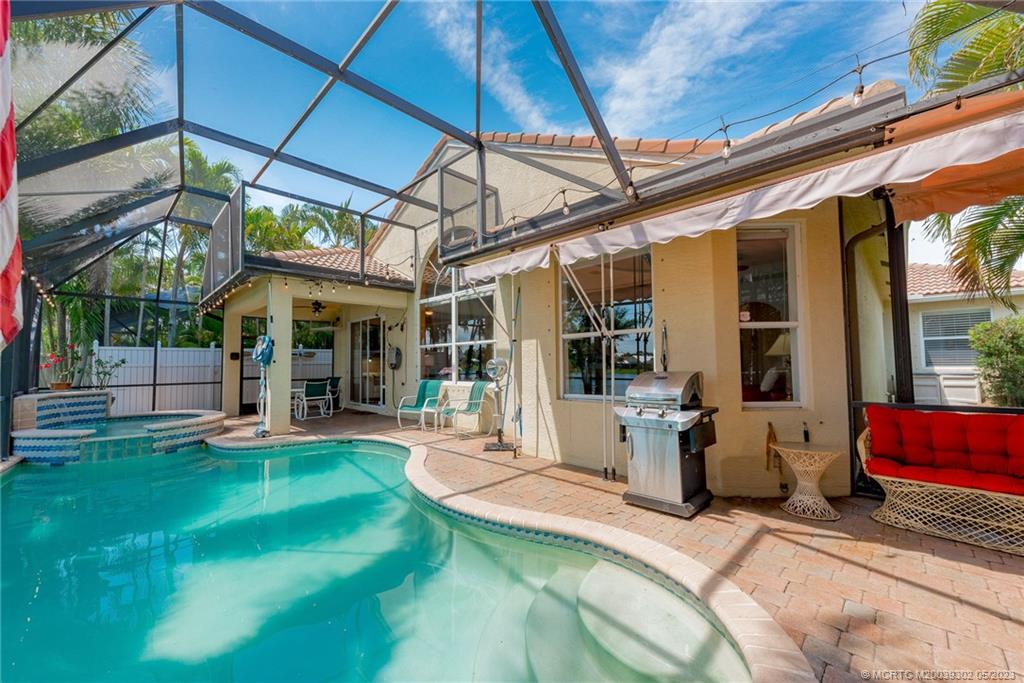 2032 Northwest Marsh Rabbit Lane Stuart, FL 34994 - Photo 3 of 30 a view of a chairs and table in patio