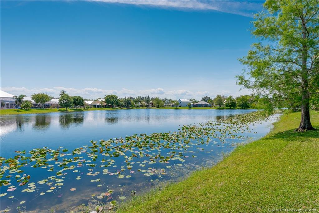 2032 Northwest Marsh Rabbit Lane Stuart, FL 34994 - Photo 5 of 30 a view of a lake with houses
