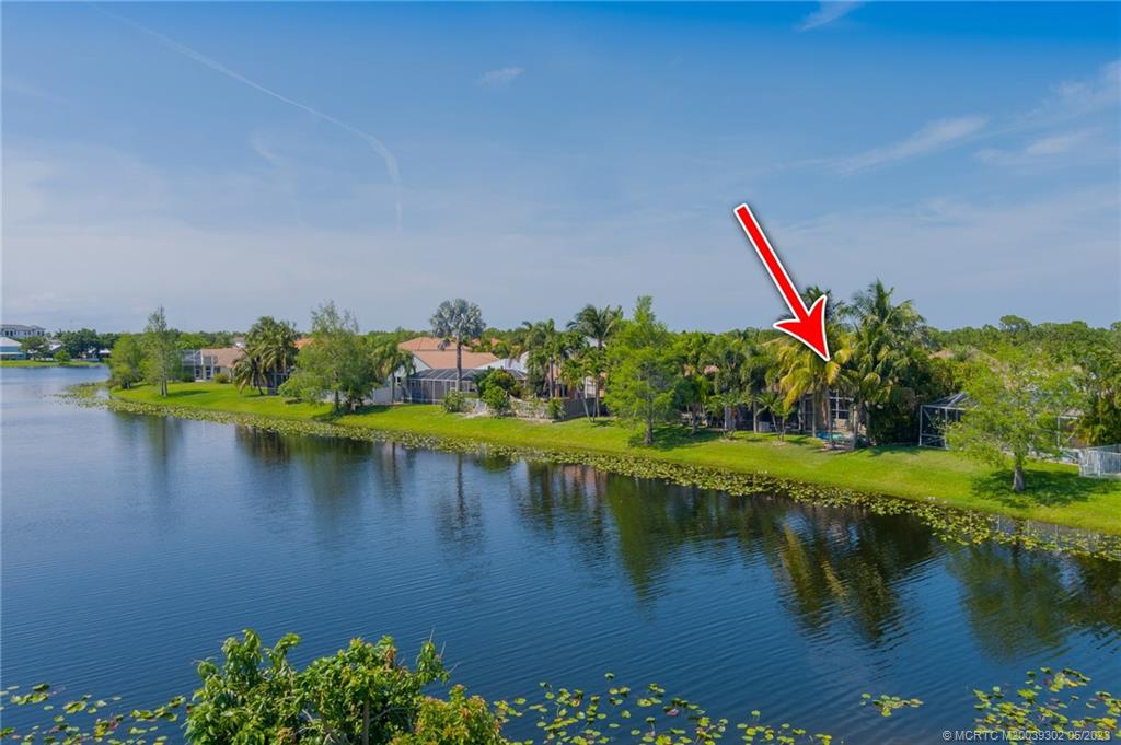 2032 Northwest Marsh Rabbit Lane Stuart, FL 34994 - Photo 8 of 30 a view of a lake with a bridge