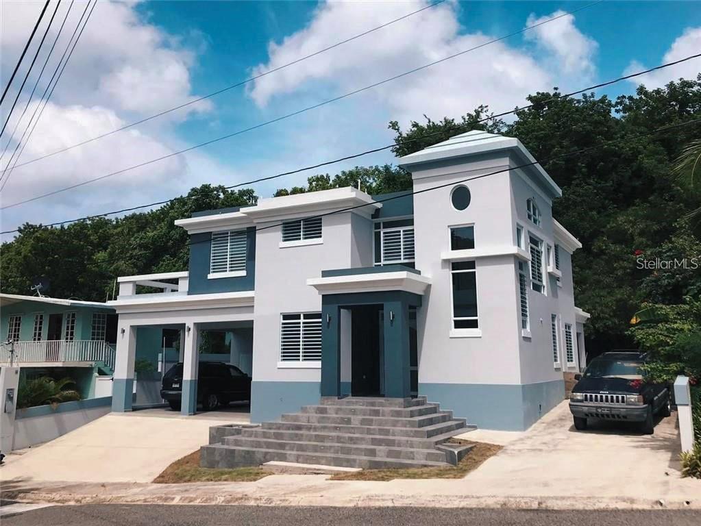 413 Colinas De Ensenada Rincon, Rincón 00677 - Photo 1 of 1 a front view of a house with a yard