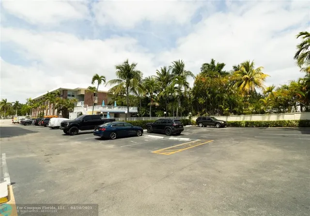 a view of street with parked cars