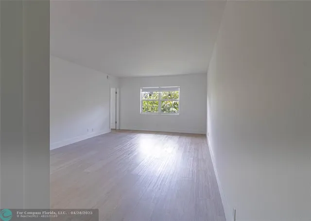 an empty room that has a window